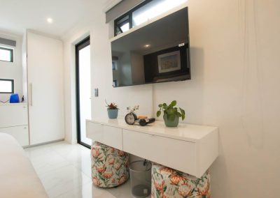 Wall mounted TV in bedrrom