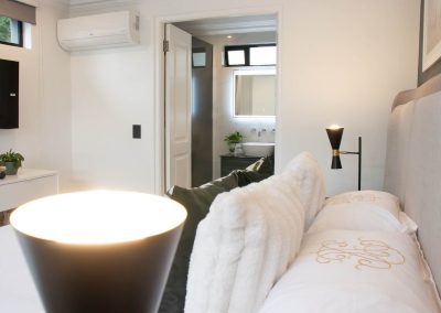 Bedroom with bathroom entrance view