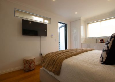 Bed and wall mounted TV
